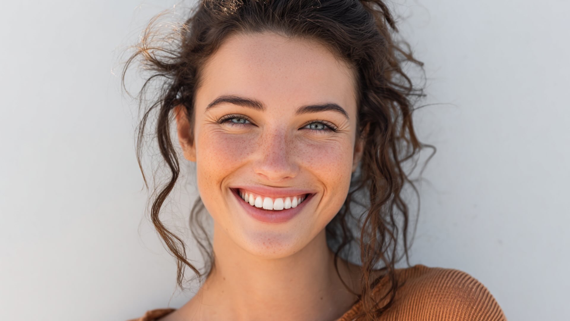 Smiling patient at Smile Well Dental